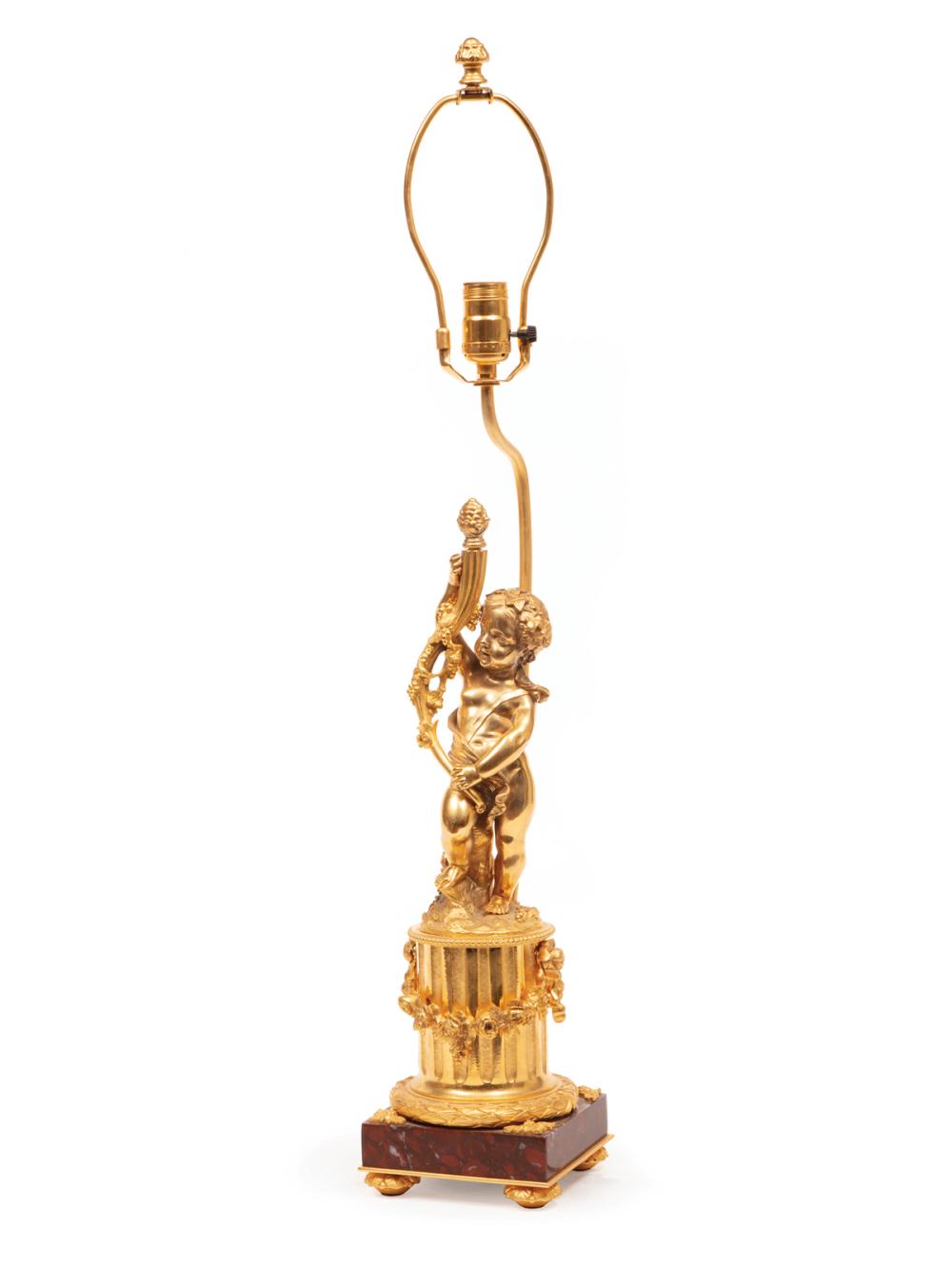 Appraisal: Louis XVI-Style Gilt Bronze Figural Lamp cherub standard rouge marble