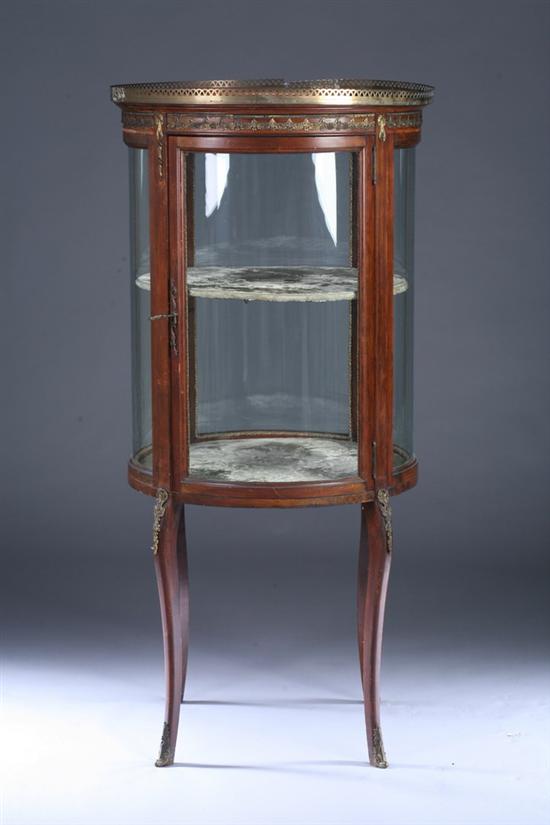 Appraisal: LOUIS XVI STYLE CYLINDRICAL VITRINE CABINET th century with gilt-metal