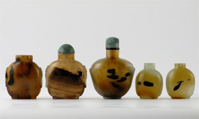 Appraisal: Five Chinese agate snuff bottles two with carved mask side