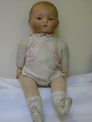 Appraisal: An Armand Marseille bisque head baby doll with blue glass