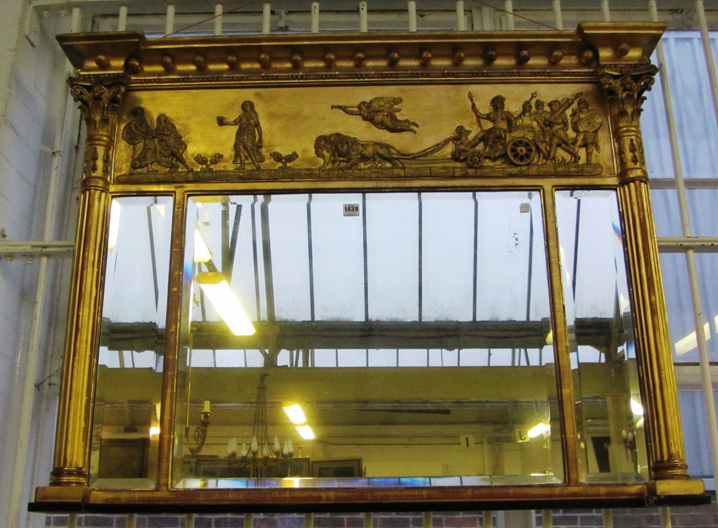 Appraisal: A Regency gilt framed triple plate overmantel mirror with chariot