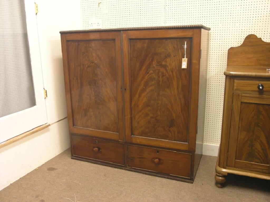 Appraisal: A mid th century linen press reduced pair of flame-veneered