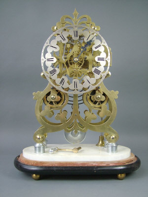 Appraisal: A Victorian style brass skeleton clock the eight day chain