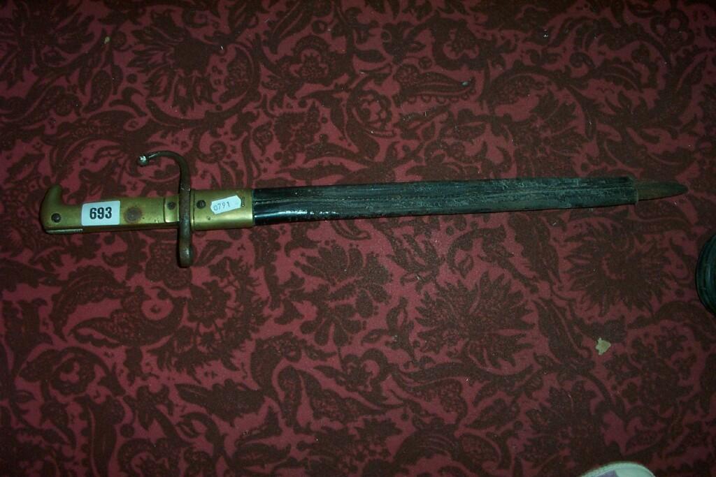 Appraisal: A late th century bayonet with brass grip and leather