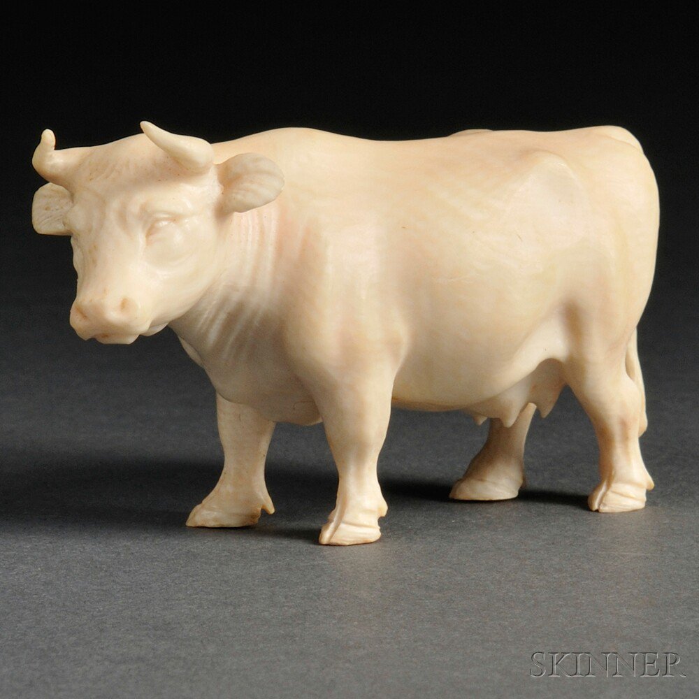 Appraisal: Ivory Carving of a Cow Japan th century standing with