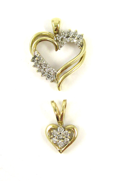 Appraisal: TWO DIAMOND AND YELLOW GOLD HEART PENDANTS including a k