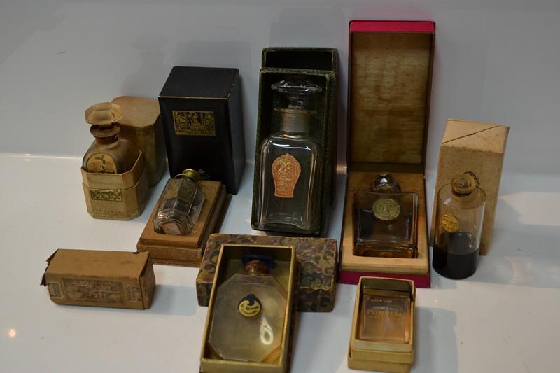 Appraisal: COLLECTION OF EIGHT ART DECO PERFUME BOTTLES IN ORIGINAL PACKAGING