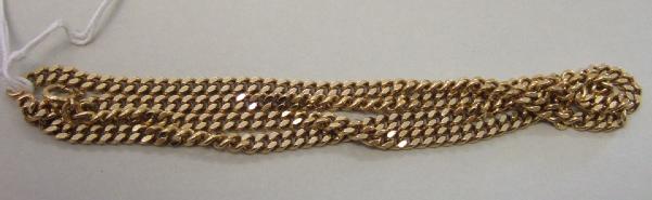 Appraisal: A gold neckchain in a faceted curb link design detailed