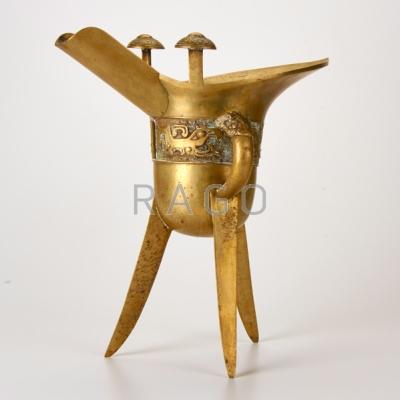 Appraisal: CHINESE JUE Tripod wine vessel with frieze of geometric designs