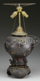 Appraisal: RELIEF DECORATED BRONZE JAR Meiji Period Japan The footed jar