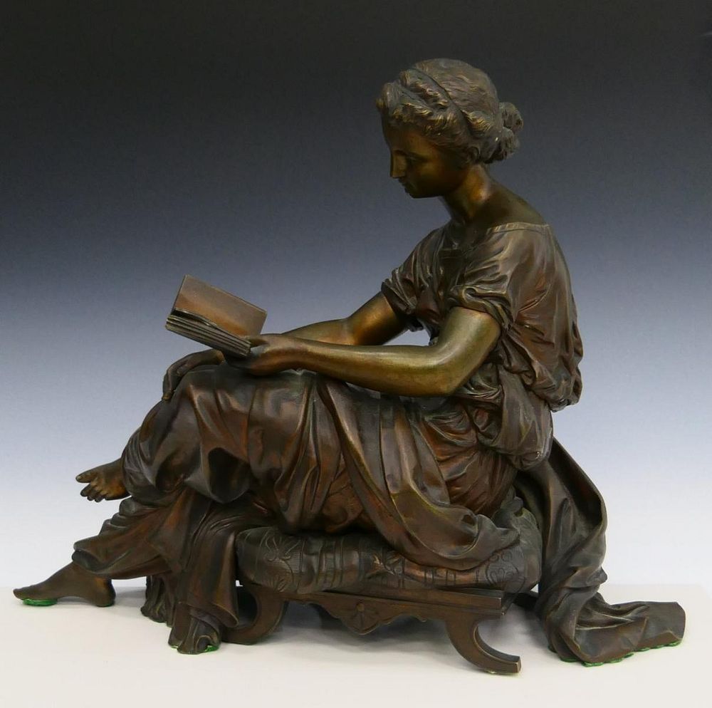 Appraisal: HEAVY BRONZE FIGURINE OF ROMAN WOMAN READING BOOK No apparent