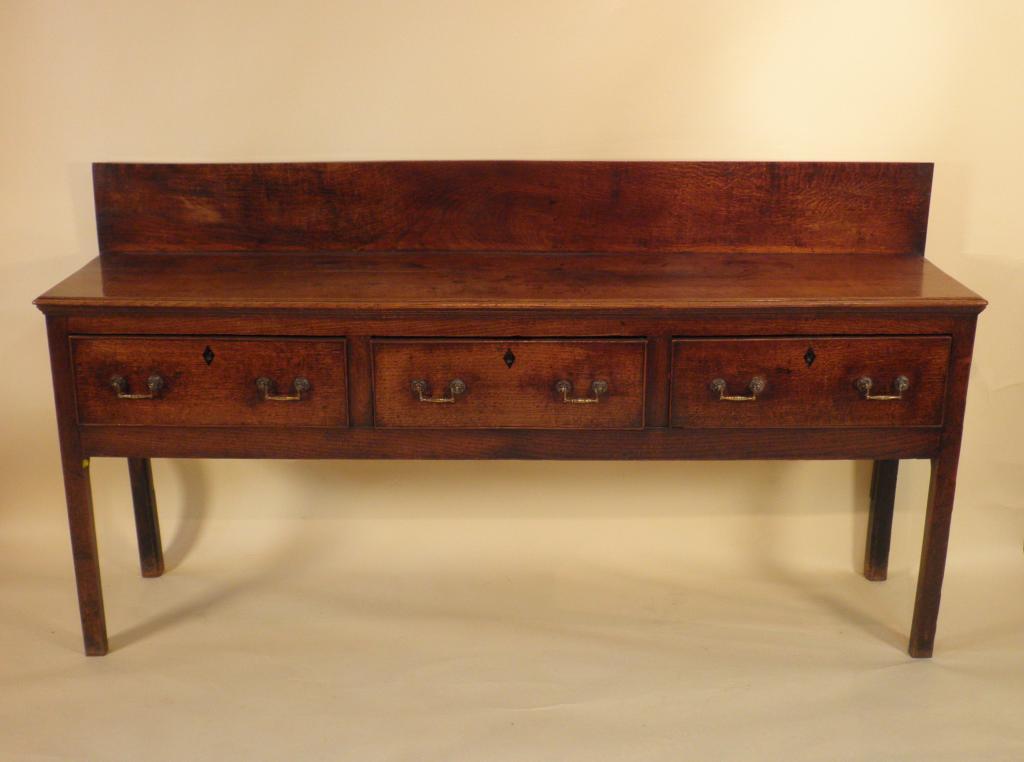 Appraisal: A George III oak dresser base with a raised back