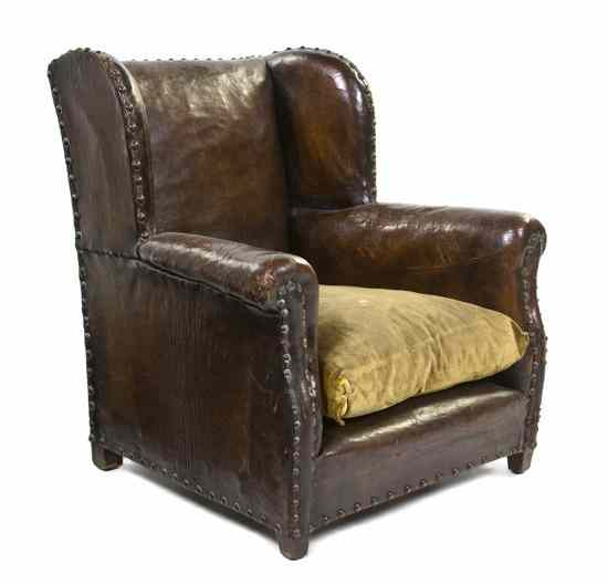 Appraisal: A George III Leather Upholstered Wingback Child's Chair having nailhead