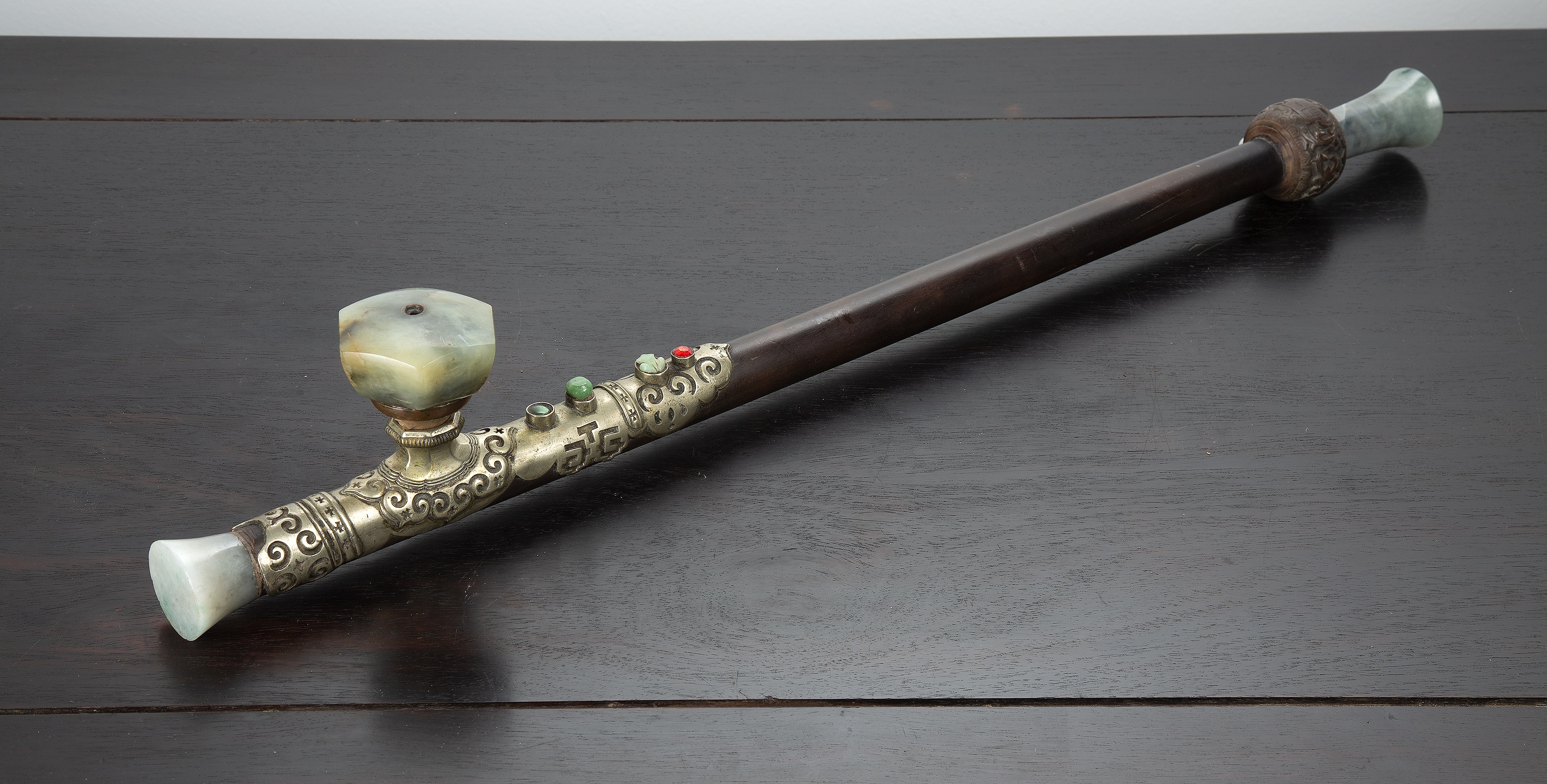 Appraisal: Opium pipeChinese late th Century having a hardwood stem with