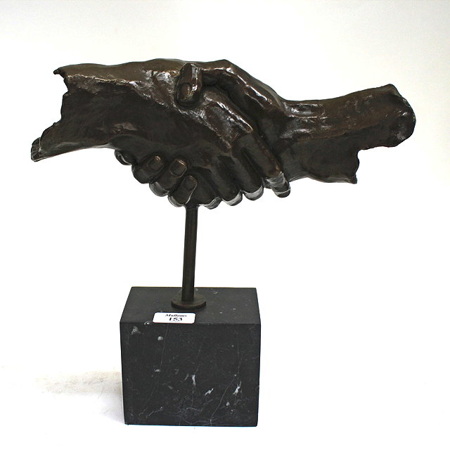 Appraisal: A CONTEMPORARY BRONZE SCULPTURE of hands shaking on a rectangular