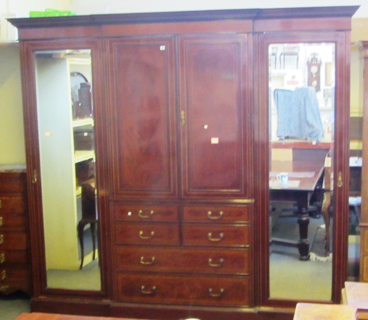 Appraisal: A late th century satinwood banded mahogany breakfront compactum wardrobe