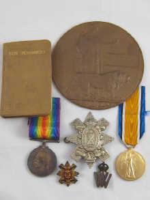 Appraisal: A collection of six medals and badges relating to Pte