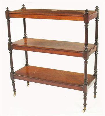 Appraisal: A Victorian mahogany three tier buffet with turned support and