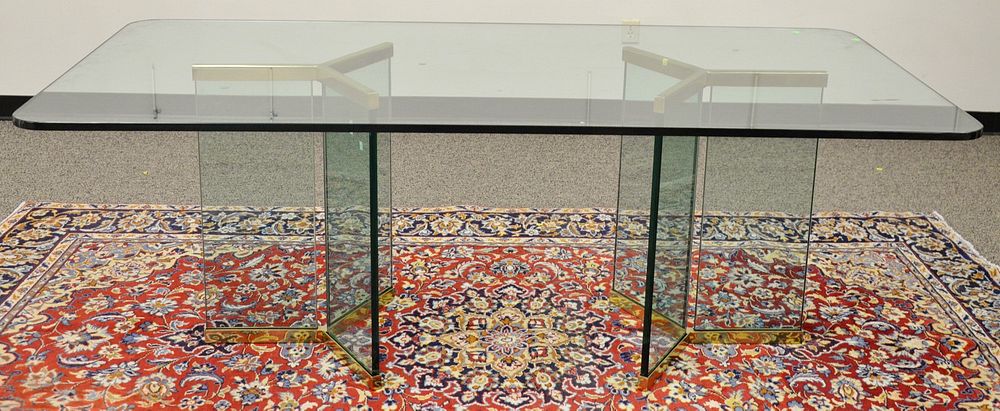 Appraisal: Glass top table on double brass trimmed glass bases ht