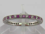 Appraisal: A Tiffany platinum ruby and diamond eternity ring signed to