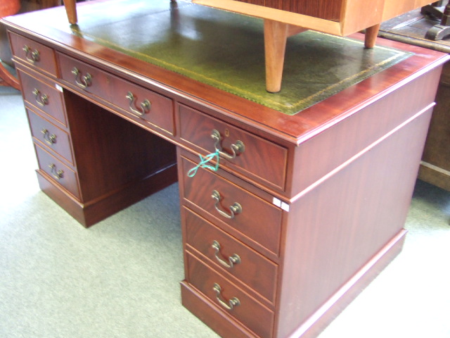 Appraisal: A th century mahogany pedestal desk the green leather inset