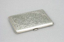 Appraisal: Iranian Silver Cigarette Case Elaborate etched design of lush foliage