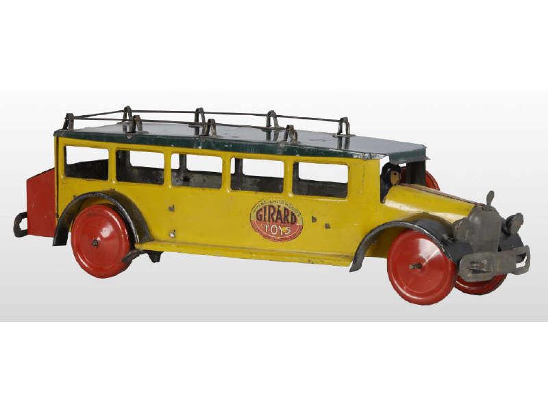 Appraisal: Girard Tin Wind-Up Bus Toy Description Working Includes original driver