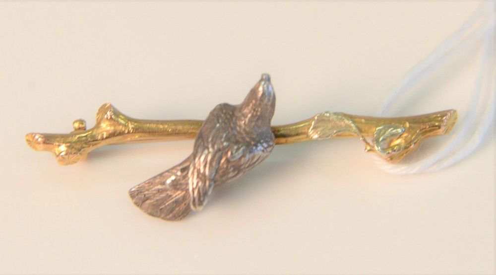 Appraisal: Gold Pin in form of a branch mounted with bird