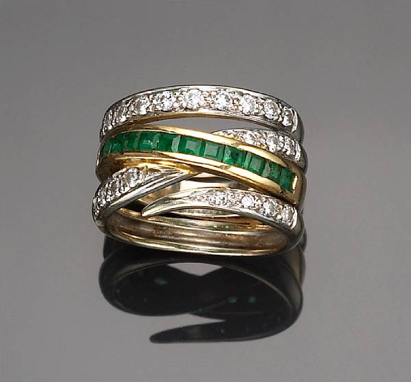 Appraisal: A diamond and emerald ring mounted in eighteen karat bicolor