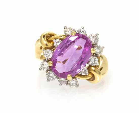 Appraisal: A Yellow Gold Pink Sapphire and Diamond Ring containing an