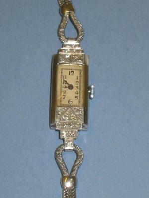 Appraisal: A LADY'S DIAMOND COCKTAIL WATCH with silvered oblong dial in