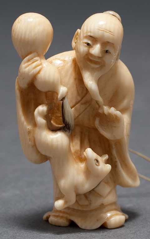 Appraisal: Japanese carved ivory netsuke old man with double gourd pouring