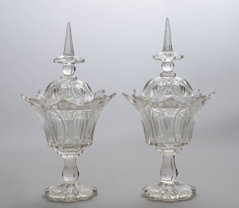 Appraisal: PAIR OF ANGLO-IRISH CUT-GLASS JARS AND COVERS Each bell-form bowl