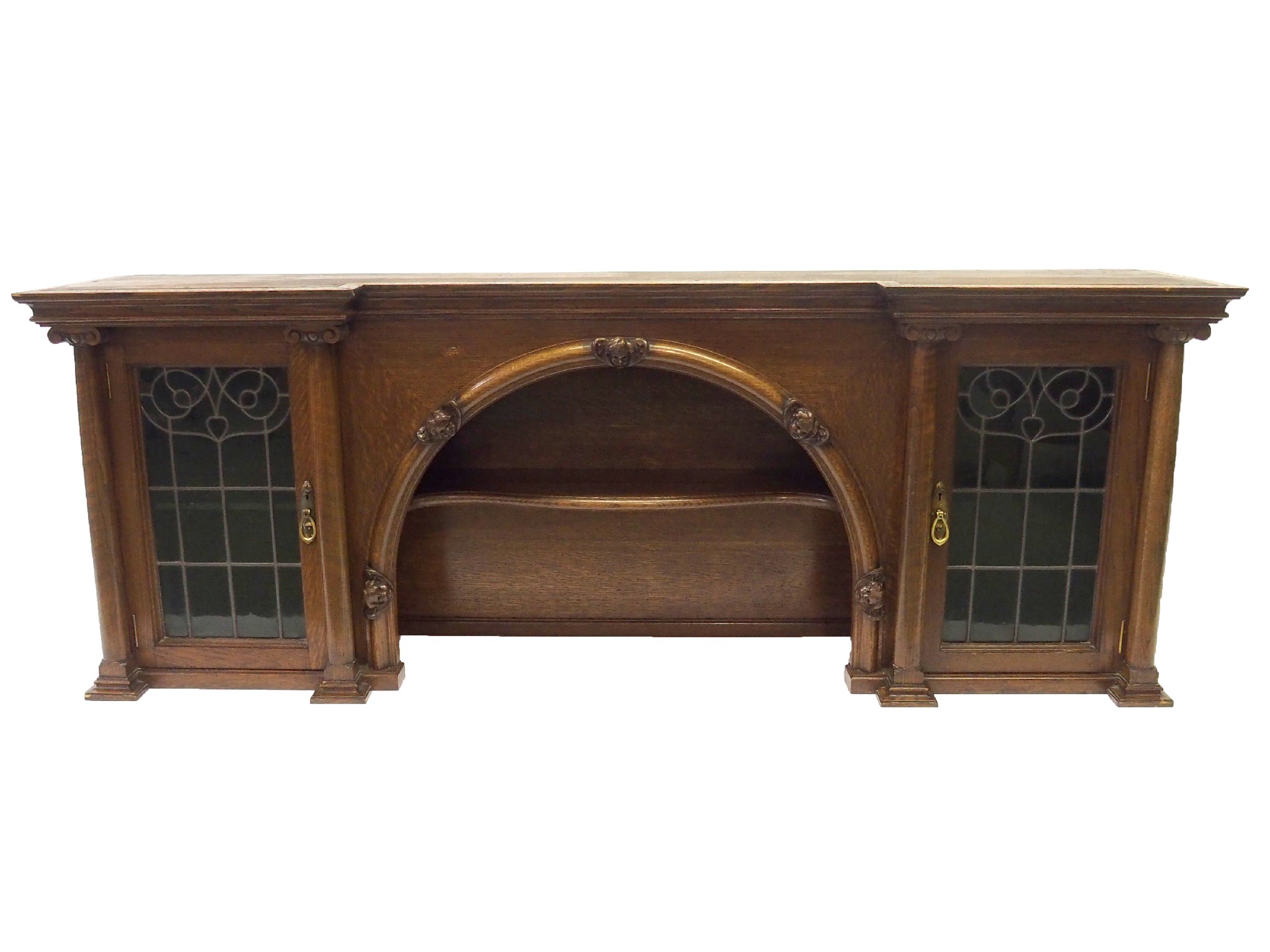 Appraisal: An Arts and Crafts oak overmantle designed by John Ednie