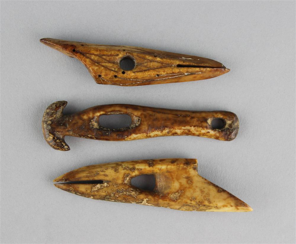 Appraisal: TWO HARPOON TIPS AND A FISHING IMPLEMENT OF CARVED BONE