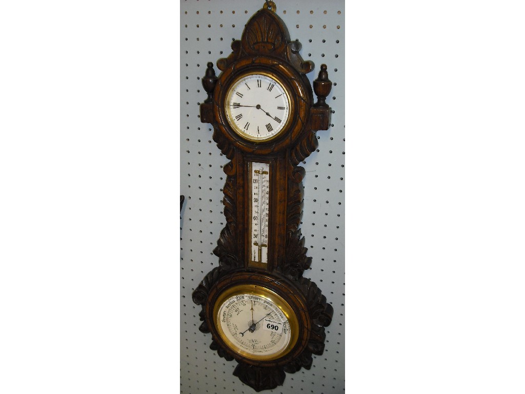 Appraisal: Oak clock and aneroid barometer the white clock dial over