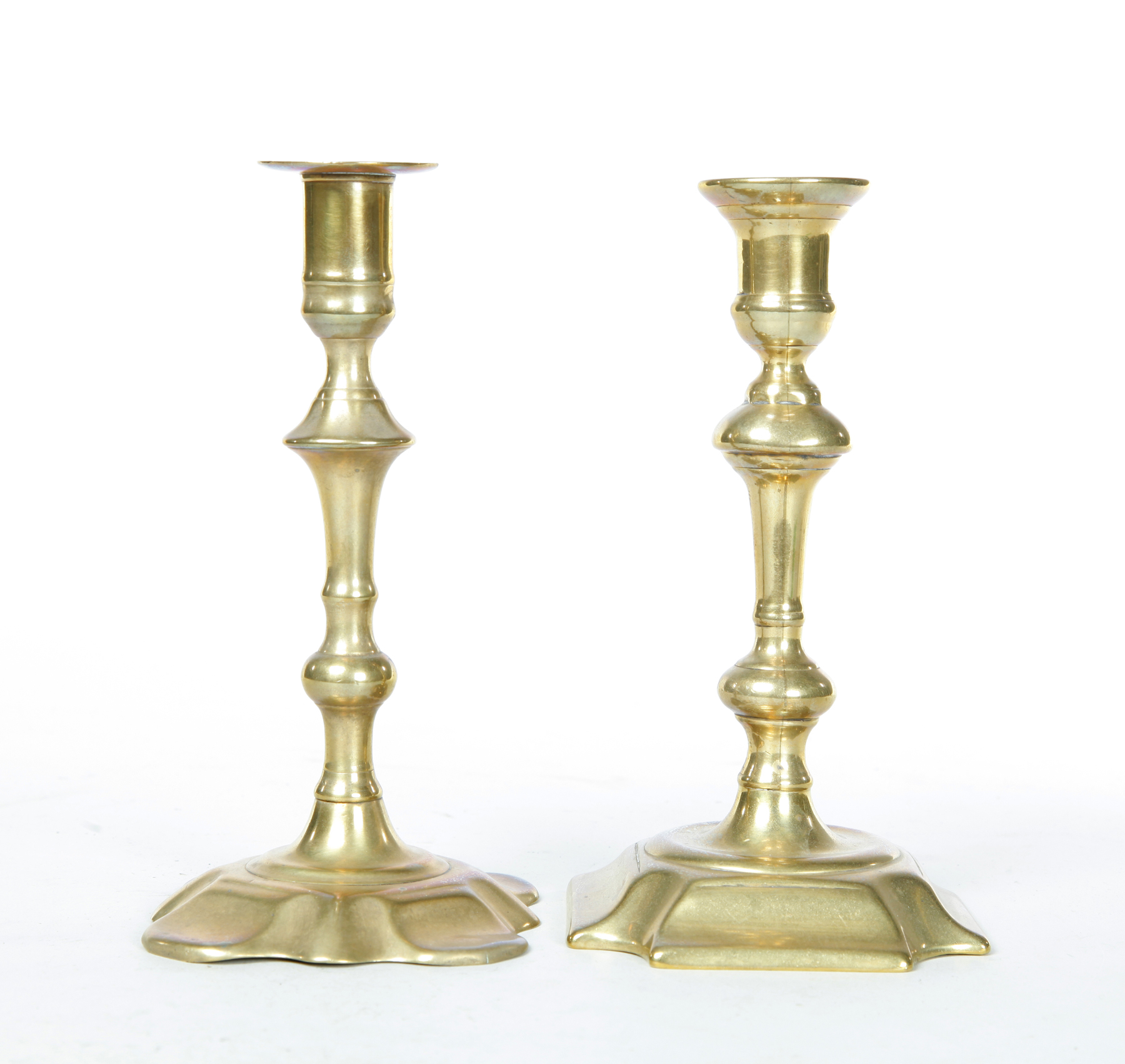 Appraisal: TWO BRASS CANDLESTICKS England st half- th century Seamed construction