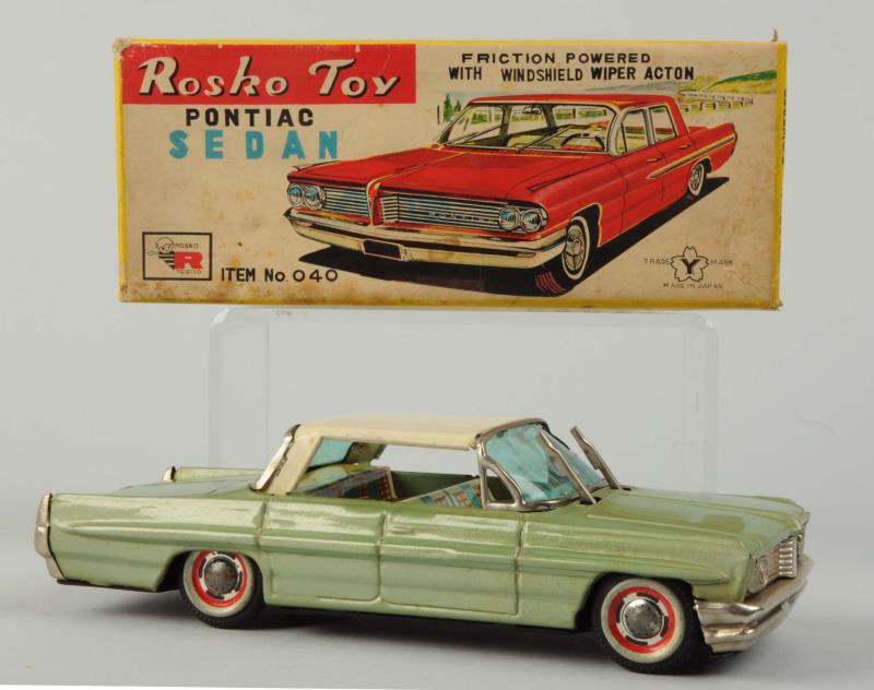 Appraisal: Japanese Tin Litho Friction Pontiac Sedan Includes original box Made