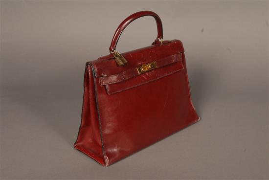 Appraisal: HERMES KELLY BAG Burgundy leather Worn dry leather