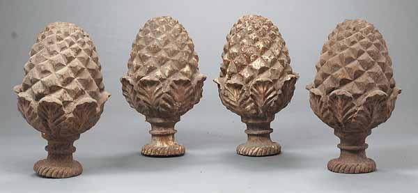 Appraisal: A Set of Four Cast Iron Pineapple Finial Garden or