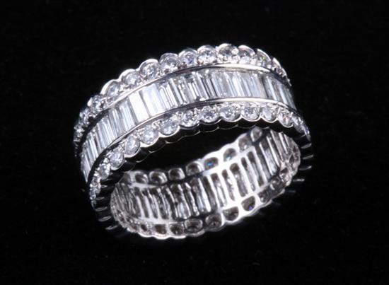 Appraisal: PLATINUM AND DIAMOND WEDDING BAND GUARD RING Circle of vertical