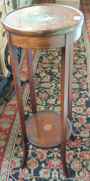 Appraisal: An Edwardian stained beech and line inlaid two tier jardinere