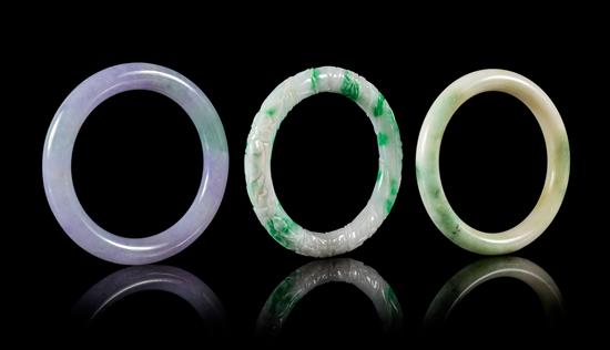 Appraisal: Sale Lot Three Jadeite Bangles each of cylindrical form the