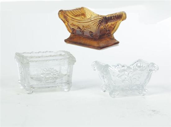 Appraisal: THREE LACY GLASS SALTS American nd half- th century Amber