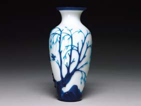 Appraisal: CARVED BLUE ON WHITE GLASS VASE Very finely detailed and