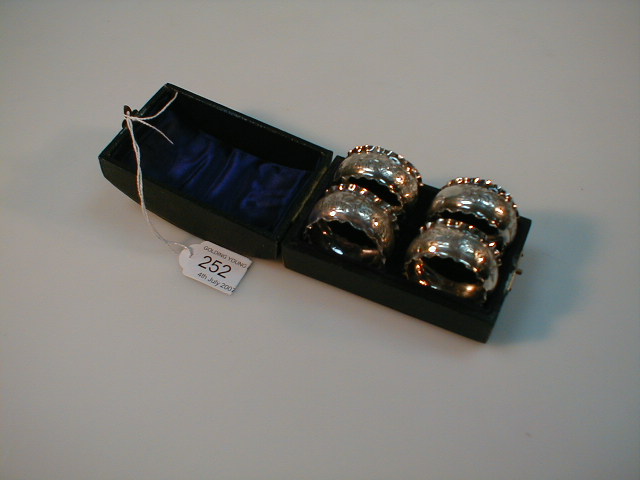 Appraisal: A set of four Edwardian silver napkin rings Chester Cased