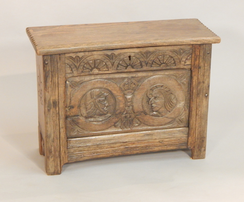 Appraisal: An oak small coffer in thC style the hinged top