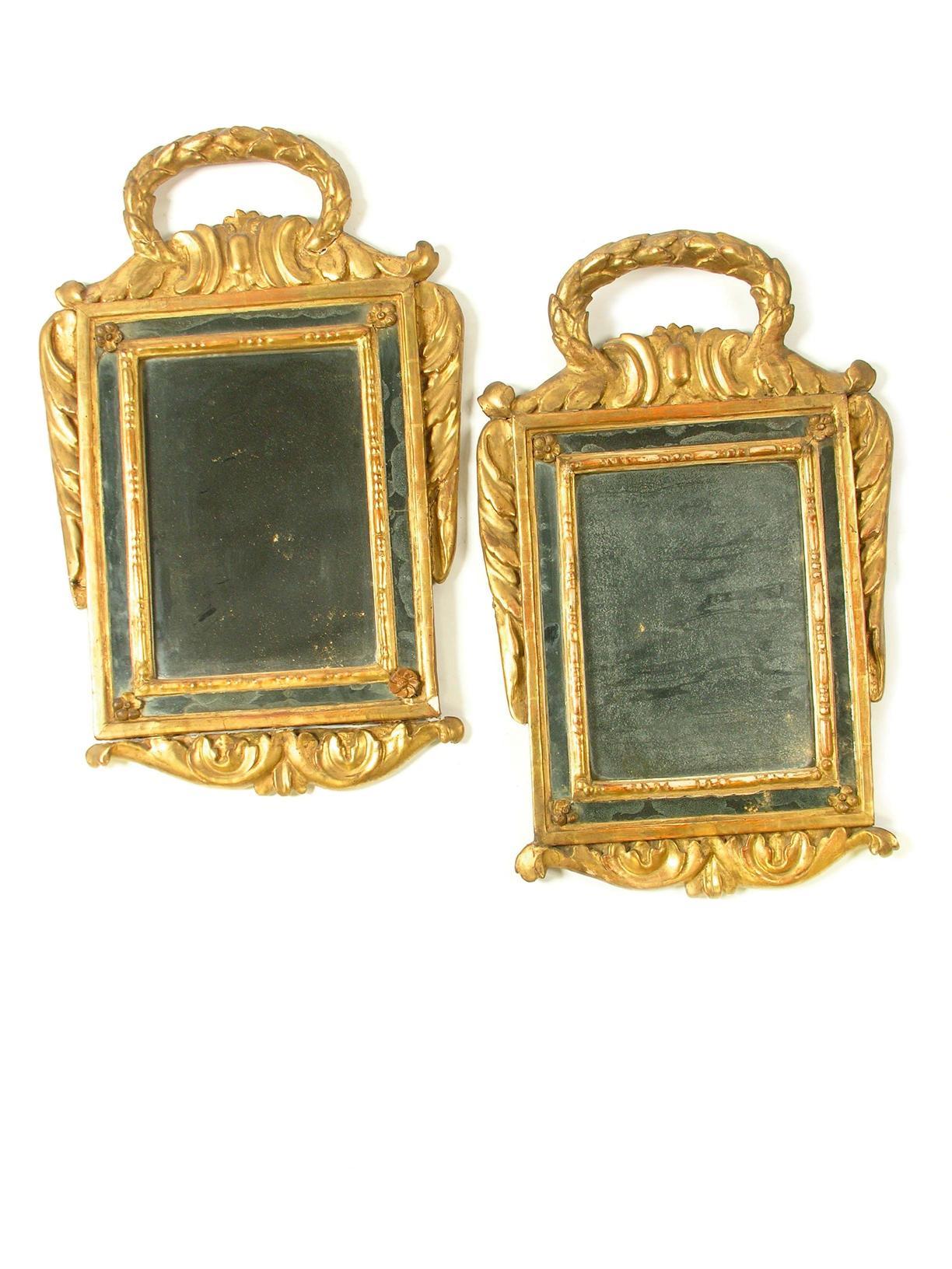 Appraisal: A pair of th century giltwood and gesso wall mirrors