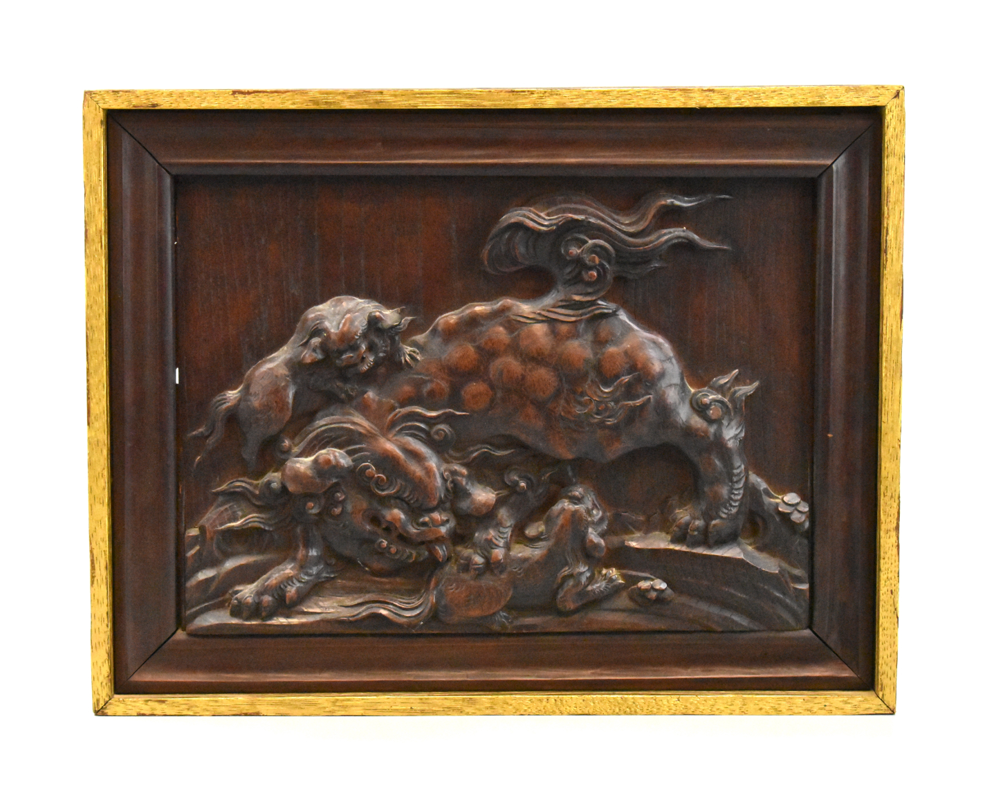 Appraisal: A Japanese Shishi foo lion carved wood panel dated to