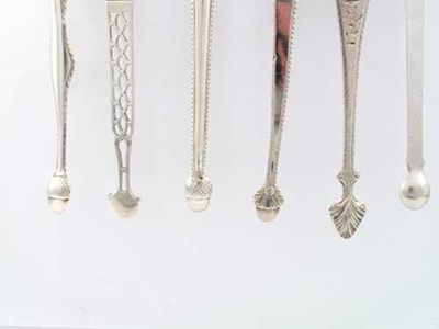 Appraisal: Six various pairs of George III sugar tongs oz